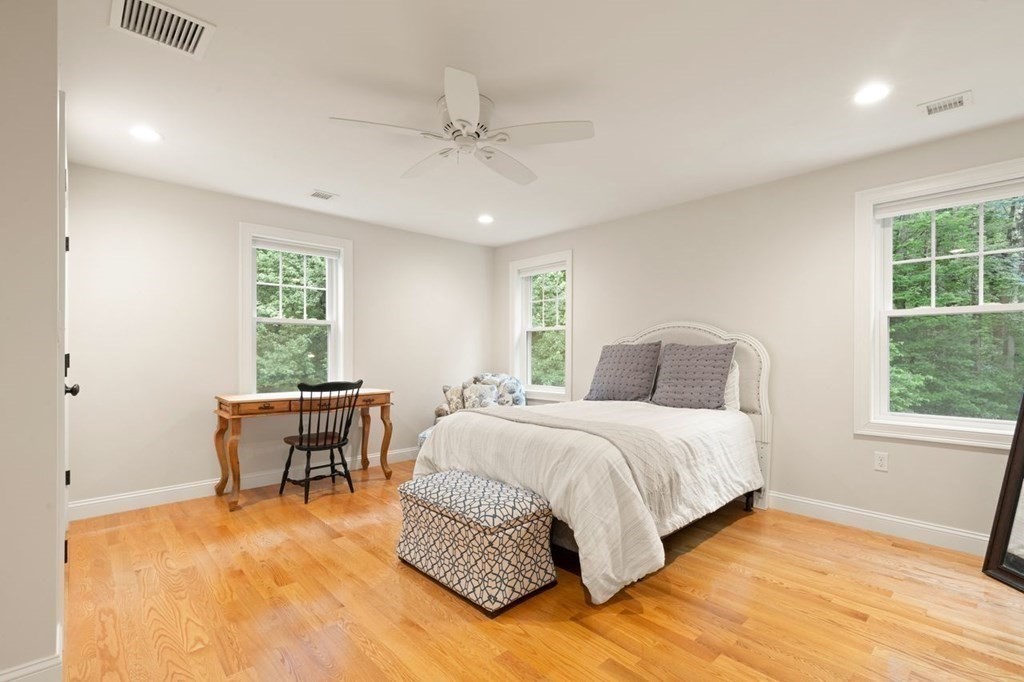21 Elm Street Canton, MA 02021 - Photo 26 of 39 a spacious bedroom with a bed and a table