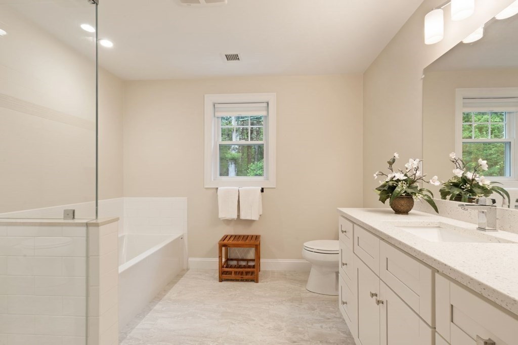 21 Elm Street Canton, MA 02021 - Photo 27 of 39 a bathroom with a sink a toilet and shower