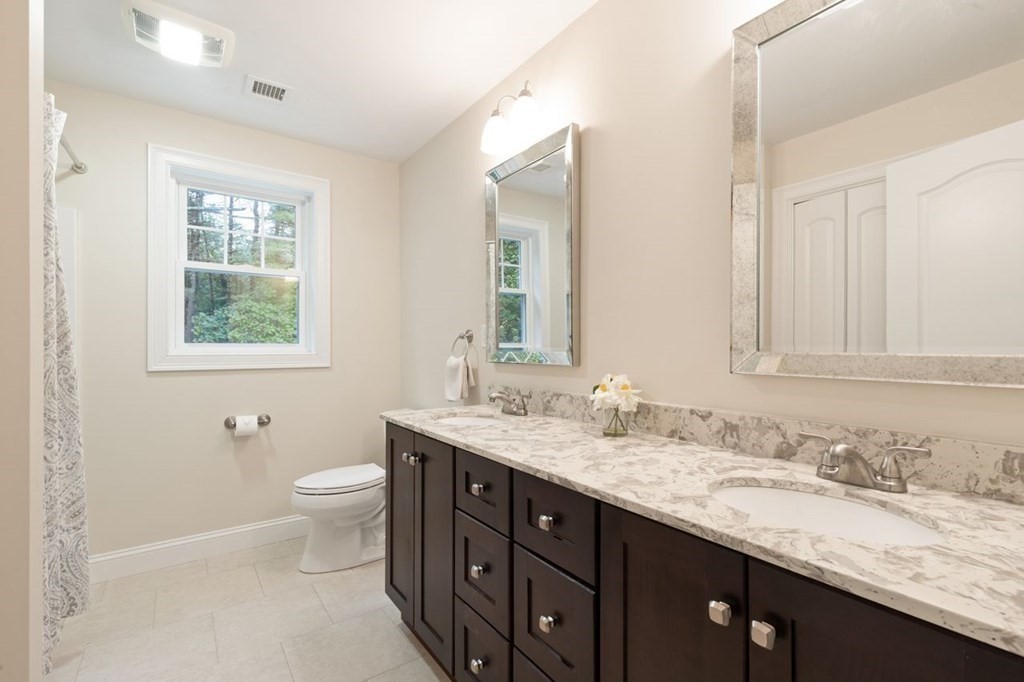 21 Elm Street Canton, MA 02021 - Photo 29 of 39 a bathroom with a granite countertop double vanity sink mirror and double