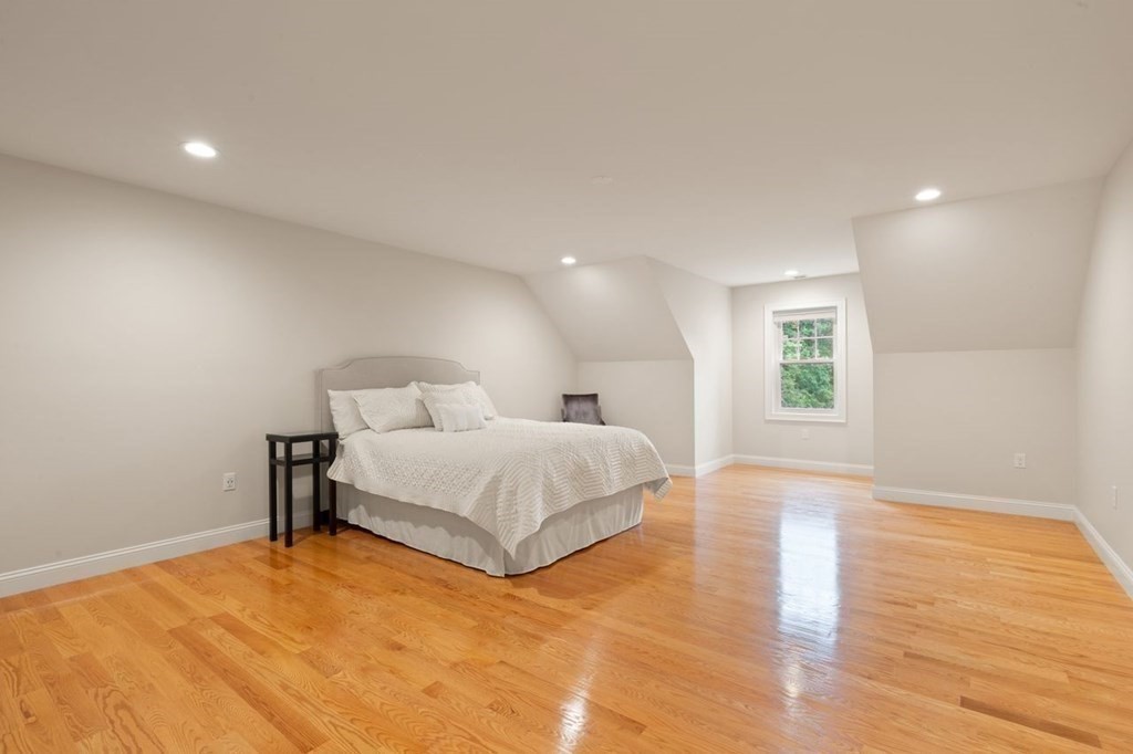 21 Elm Street Canton, MA 02021 - Photo 30 of 39 a spacious bedroom with a bed and a window
