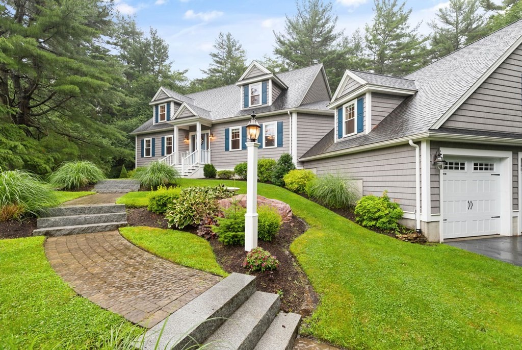 21 Elm Street Canton, MA 02021 - Photo 4 of 39 a front view of a house with a yard