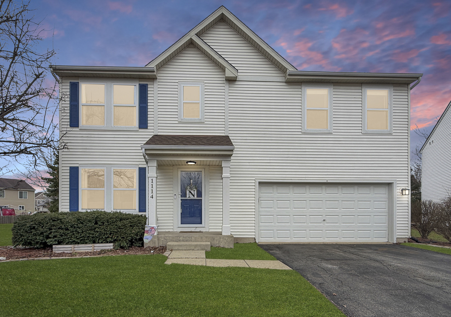 1114 Port Royal Road Pingree Grove, IL 60140 - Photo 1 of 25 a front view of a house with a garden and yard