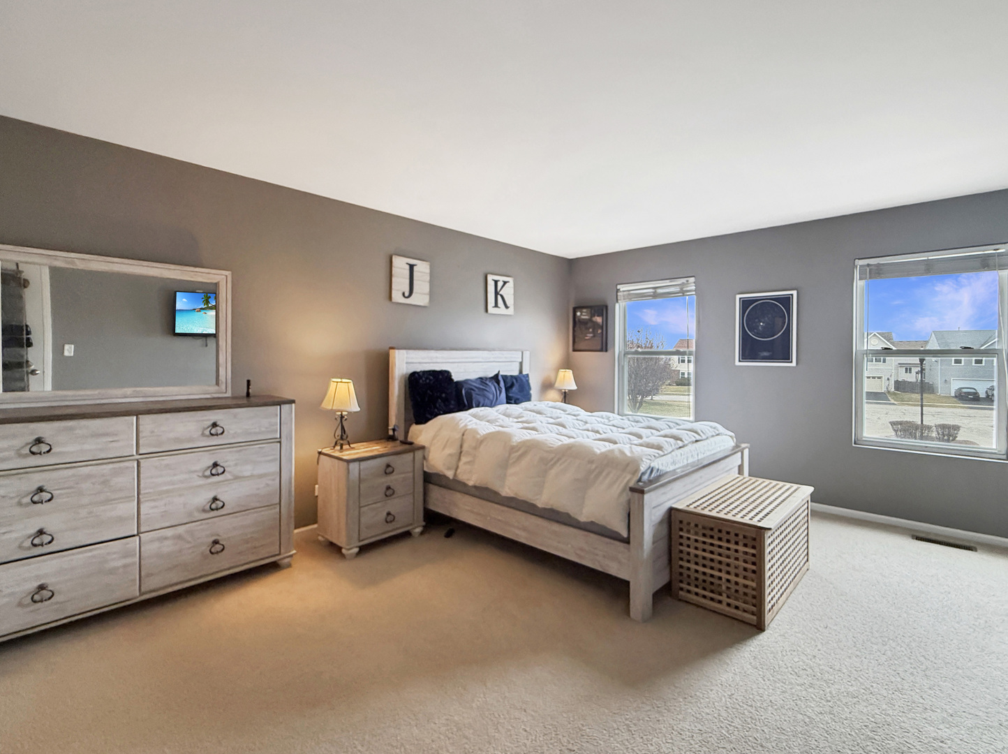 1114 Port Royal Road Pingree Grove, IL 60140 - Photo 11 of 25 a spacious bedroom with a bed and a dresser in it