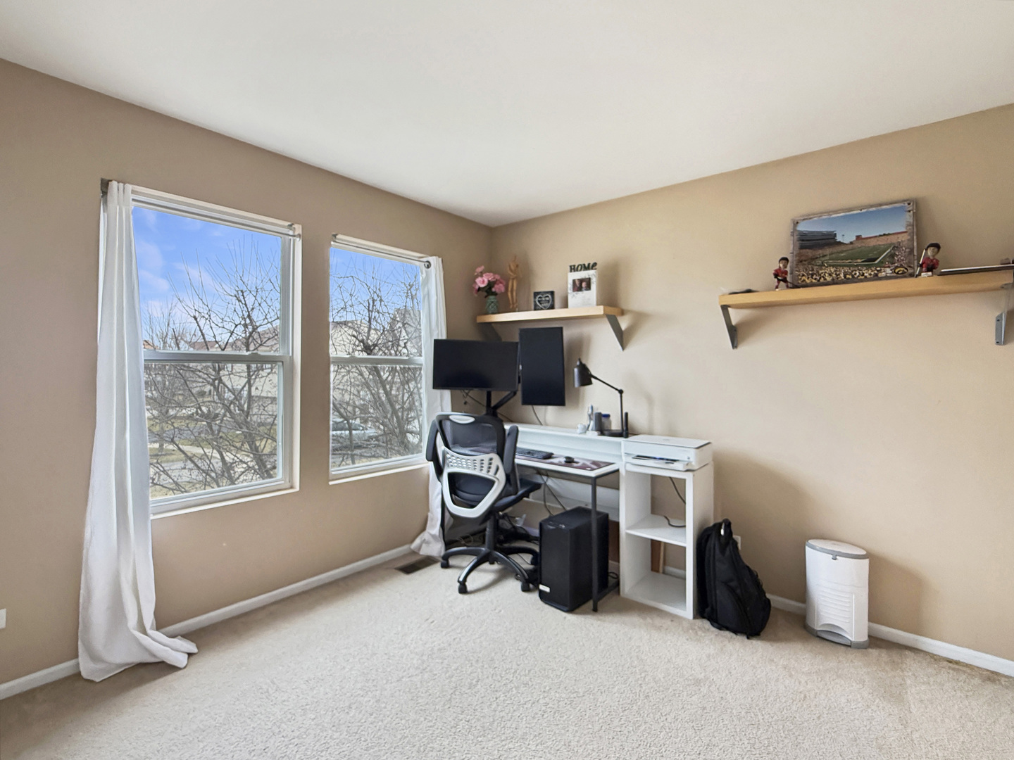 1114 Port Royal Road Pingree Grove, IL 60140 - Photo 16 of 25 a view of a workspace with furniture and a window