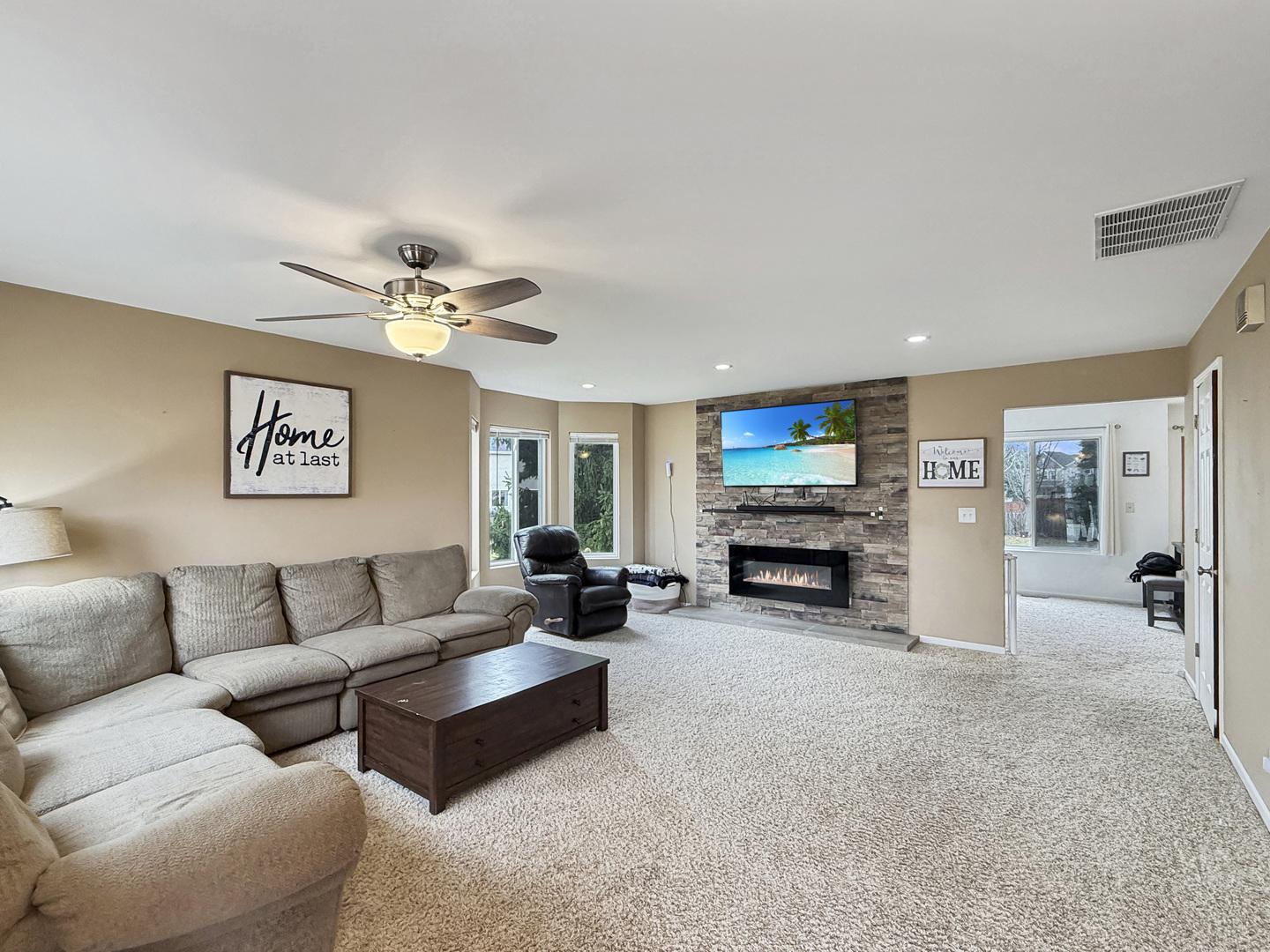 1114 Port Royal Road Pingree Grove, IL 60140 - Photo 3 of 25 a view of a livingroom with furniture and a fireplace