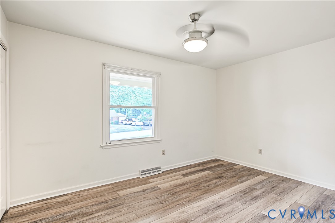 13310 Gladehill Road Chester, VA 23831 - Photo 16 of 41 Room featuring wood-finish flooring, a ceiling fan