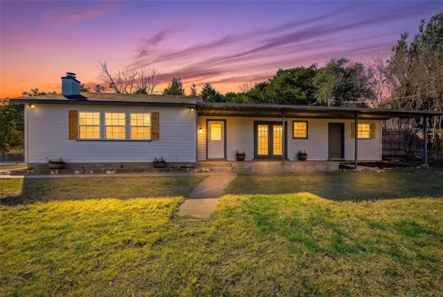 a view of house with swimming pool