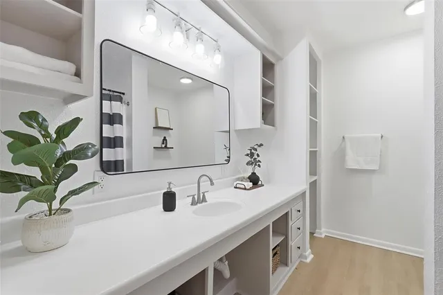 an empty room with a ceiling fan and a window