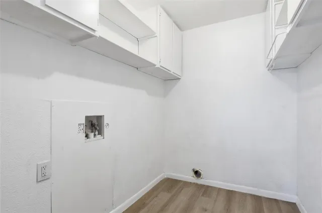 a view of a house with snow on the road