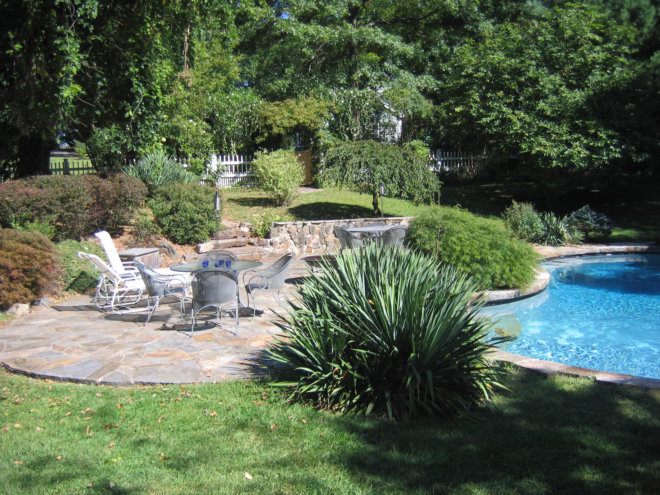525 Middlesex Road Darien, CT 06820 - Photo 11 of 11 a view of a chair and table on the garden