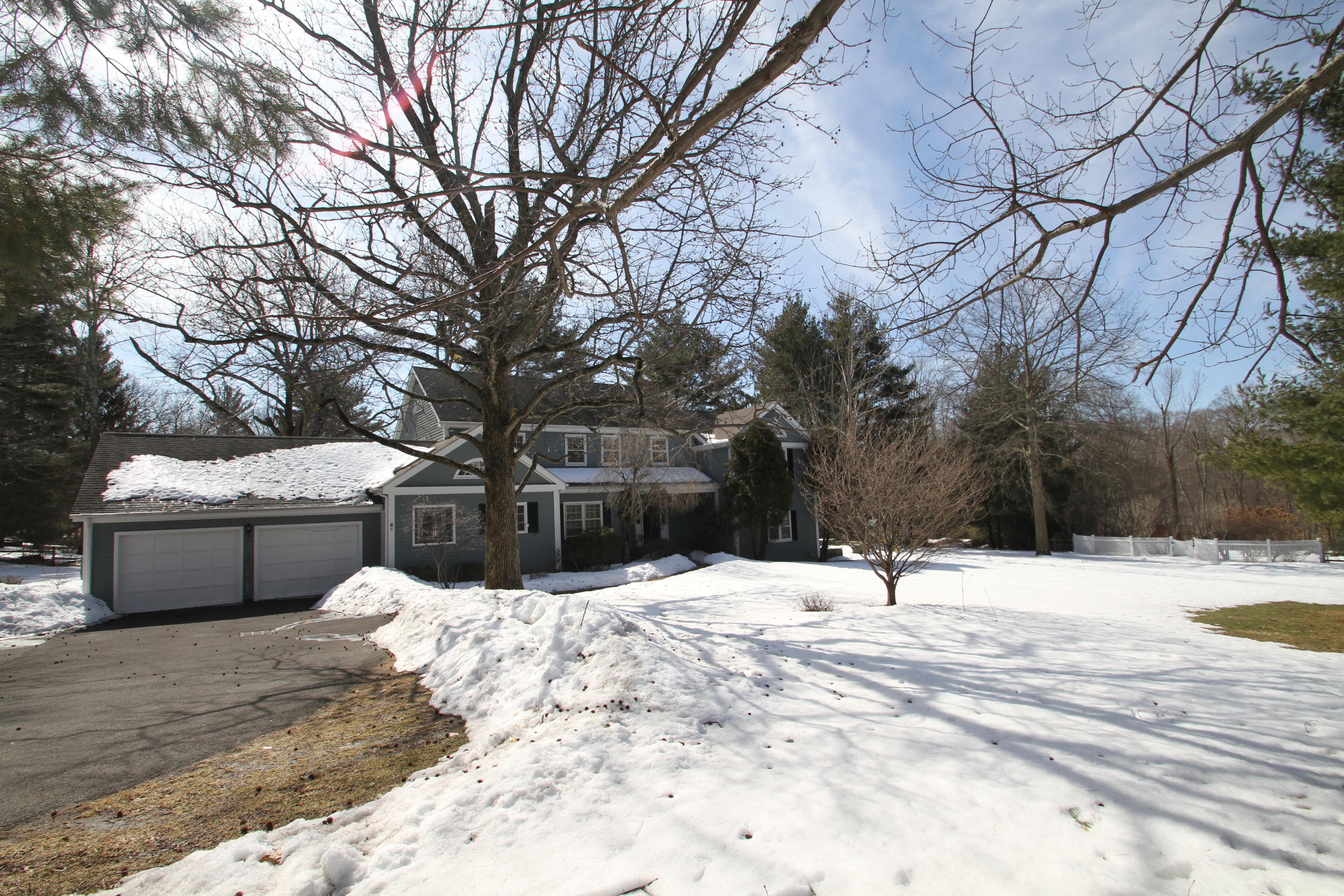 525 Middlesex Road Darien, CT 06820 - Photo 3 of 11 a view of house with snow on the road