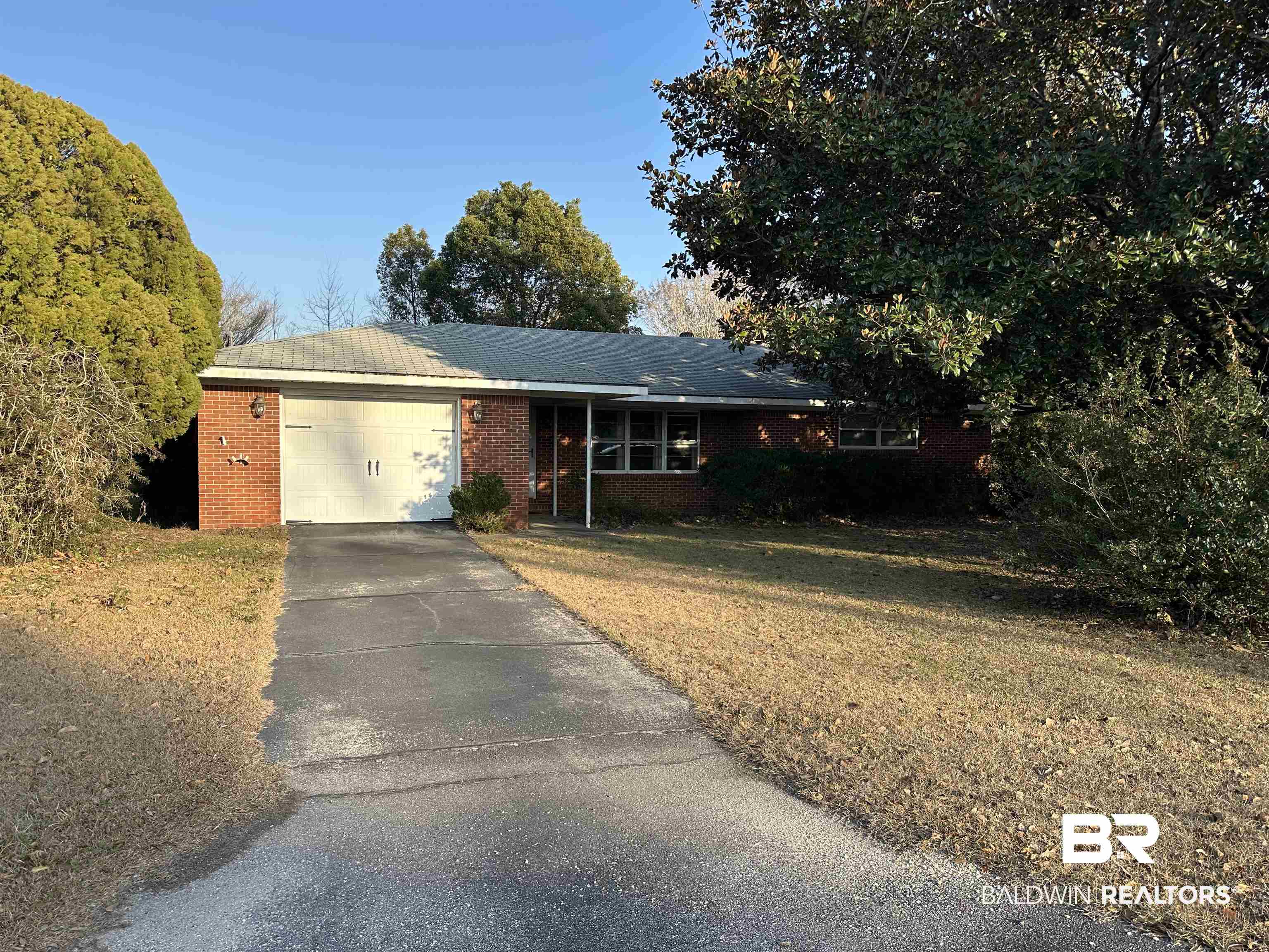 1 Yupon Circle Foley, AL 36535 - Photo 2 of 30 Single story home featuring brick siding, driveway, an attached garage, and a front yard