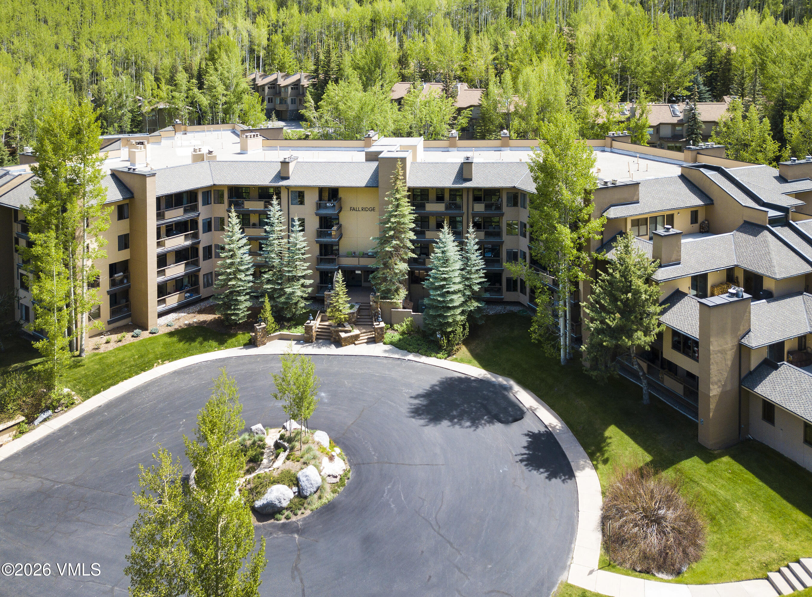 1650 Fall Ridge Road, Unit 202 Vail, CO 81657 - Photo 29 of 32 a aerial view of a house with a yard patio and swimming pool