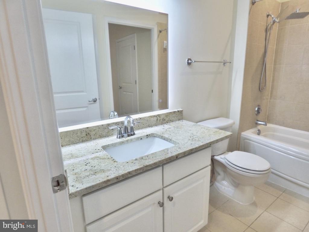 11800 Sunset Hills Road, Unit 118 Reston, VA 20190 - Photo 16 of 52 Modern bathroom with sleek finishes.