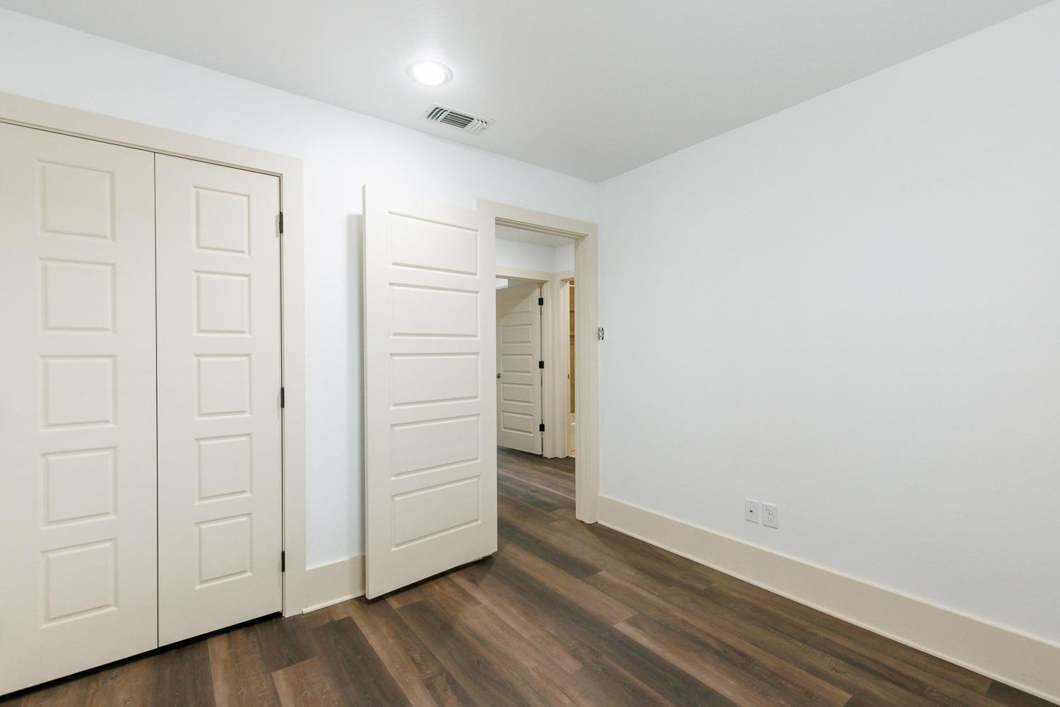 4612 121st Street Lubbock, TX 79424 - Photo 16 of 26 an empty room with wooden floor