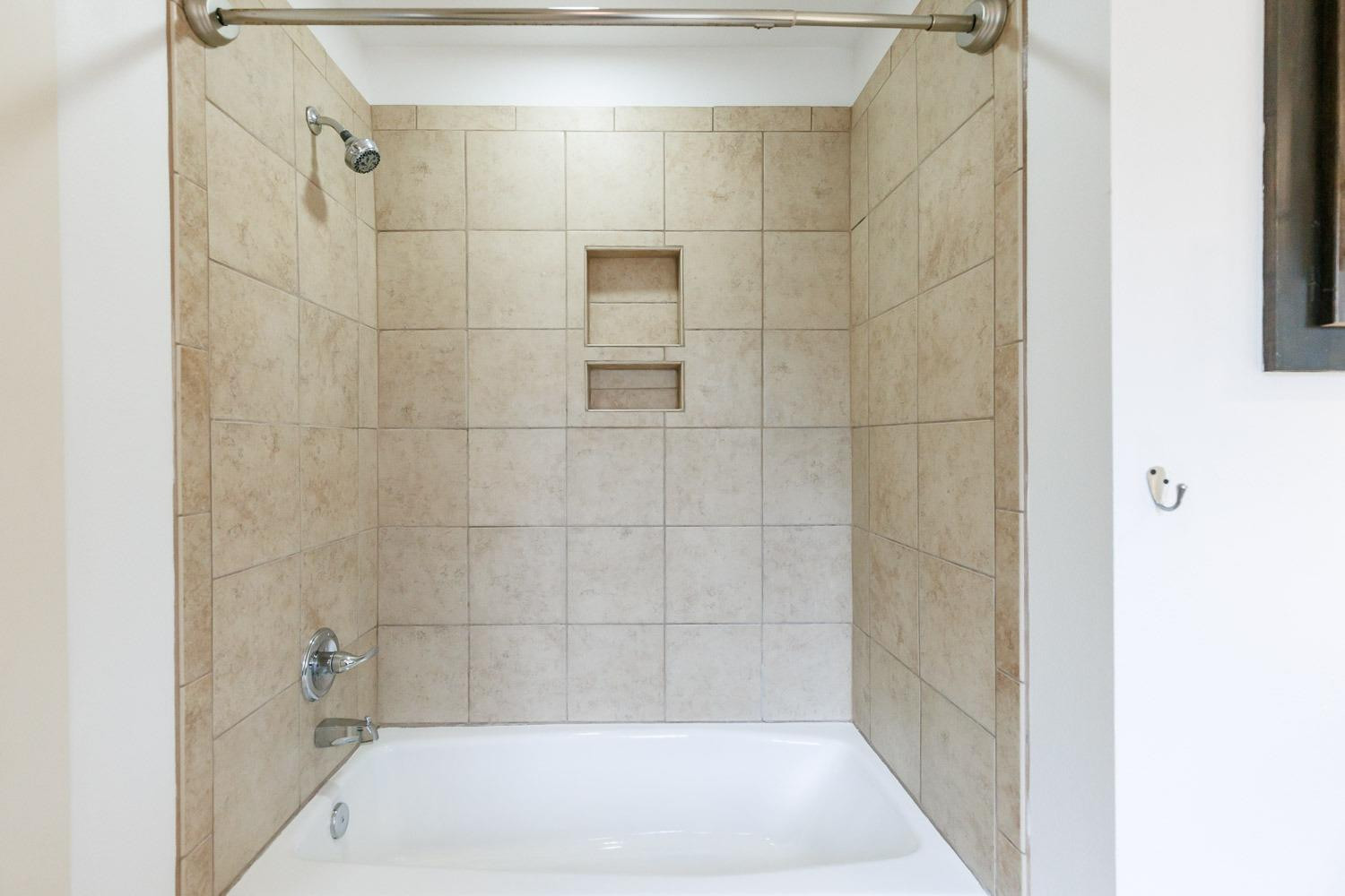 4612 121st Street Lubbock, TX 79424 - Photo 21 of 26 a bathroom with a bathtub