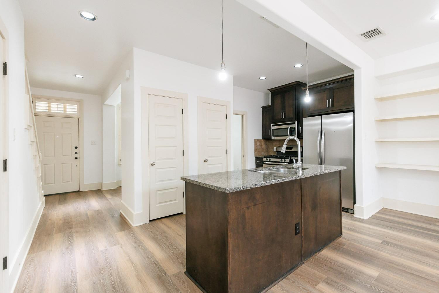 4612 121st Street Lubbock, TX 79424 - Photo 4 of 26 a kitchen with stainless steel appliances granite countertop a sink and a refrigerator