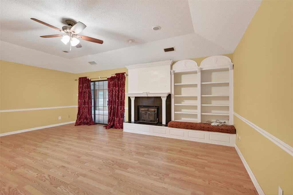 401 Cane Bend Drive Haughton, LA 71037 - Photo 8 of 27 a view of an empty room with a fireplace and a window