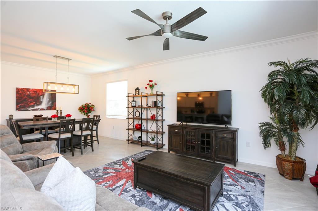 2155 Hamlin Street Naples, FL 34120 - Photo 46 of 50 Tiled living room featuring ornamental molding and ceiling fan