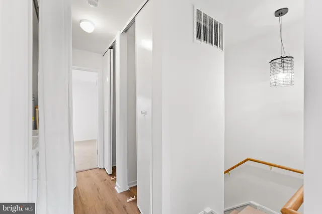a view of a hallway with closet