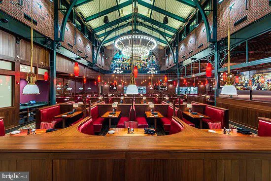 a view of the swimming pool with outdoor seating