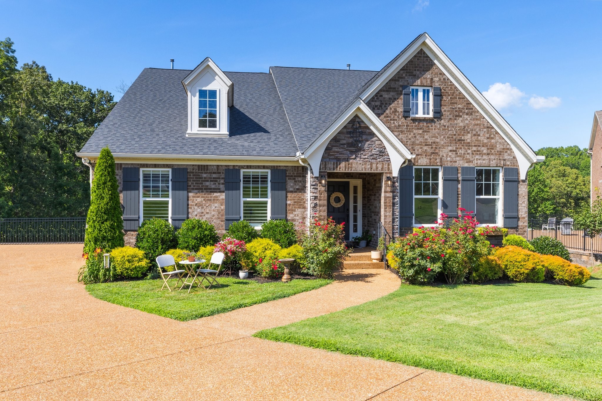 a front view of a house with garden