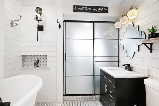 a bathroom with a sink and mirror
