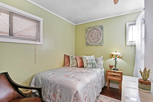 a bedroom with a bed and a couch