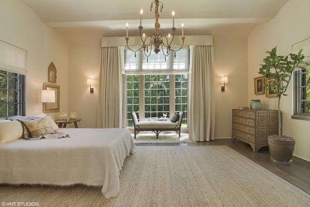 96 Woodley Road Winnetka, IL 60093 - Photo 15 of 22 a spacious bedroom with a bed and a chandelier