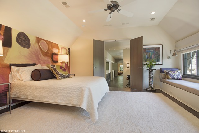 96 Woodley Road Winnetka, IL 60093 - Photo 19 of 22 a bedroom with a large bed and a chandelier