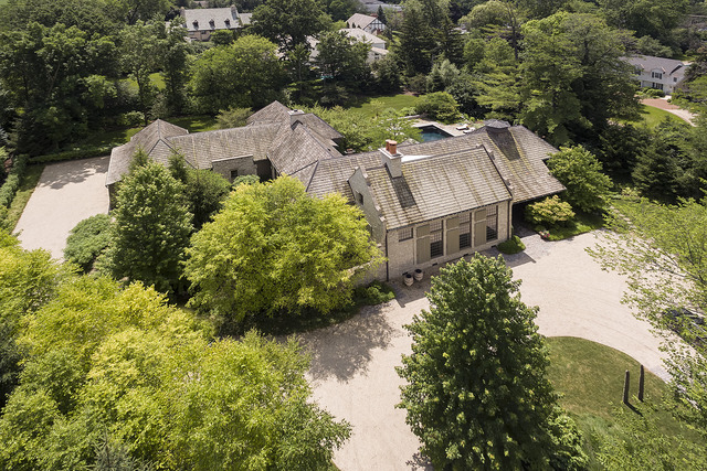 96 Woodley Road Winnetka, IL 60093 - Photo 2 of 22 an aerial view of a house with a garden