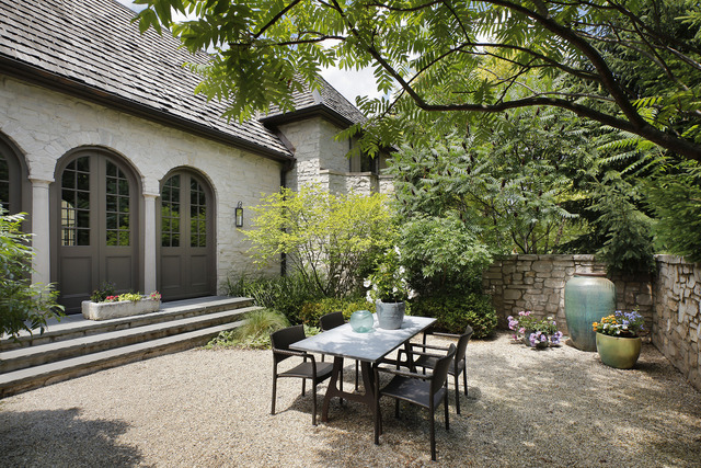 96 Woodley Road Winnetka, IL 60093 - Photo 21 of 22 a backyard of a house with table and chairs