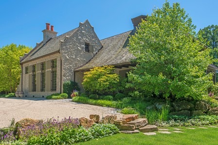 96 Woodley Road Winnetka, IL 60093 - Photo 3 of 22 a front view of a house with garden