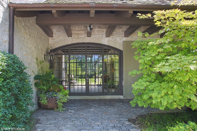 96 Woodley Road Winnetka, IL 60093 - Photo 5 of 22 a front view of a house with garden