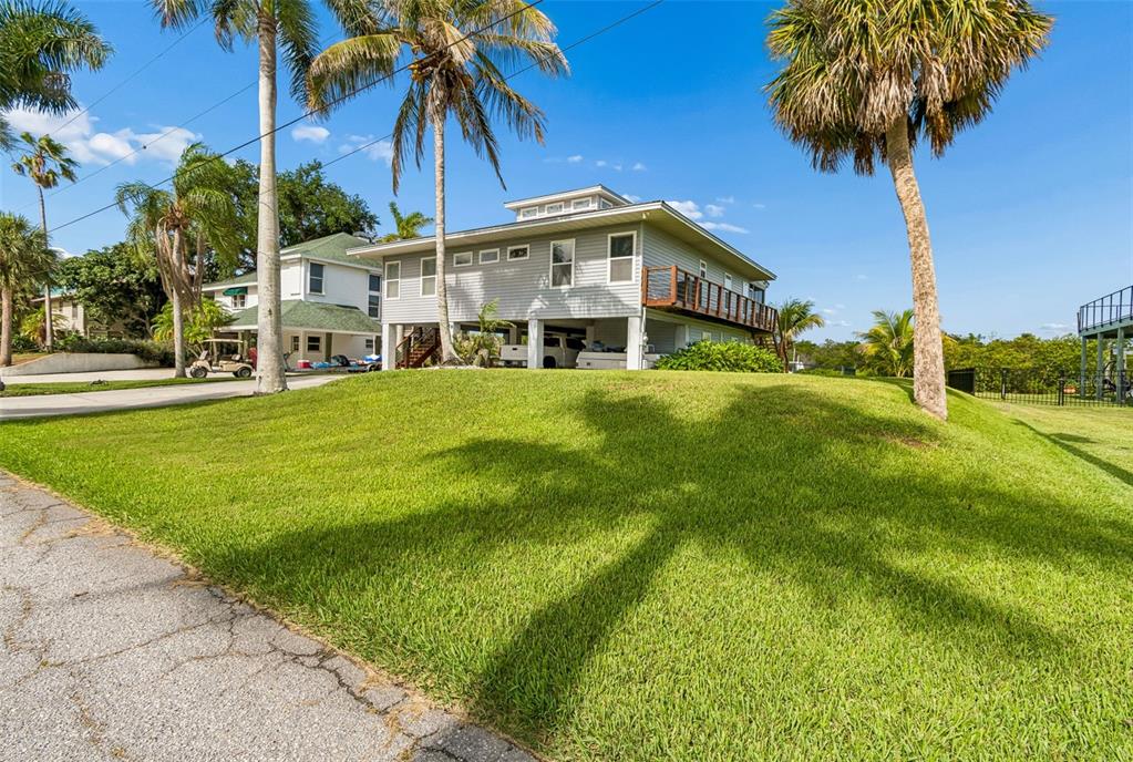 119 Burns Road Terra Ceia, FL 34250 - Photo 6 of 100 a front view of house with yard and green space