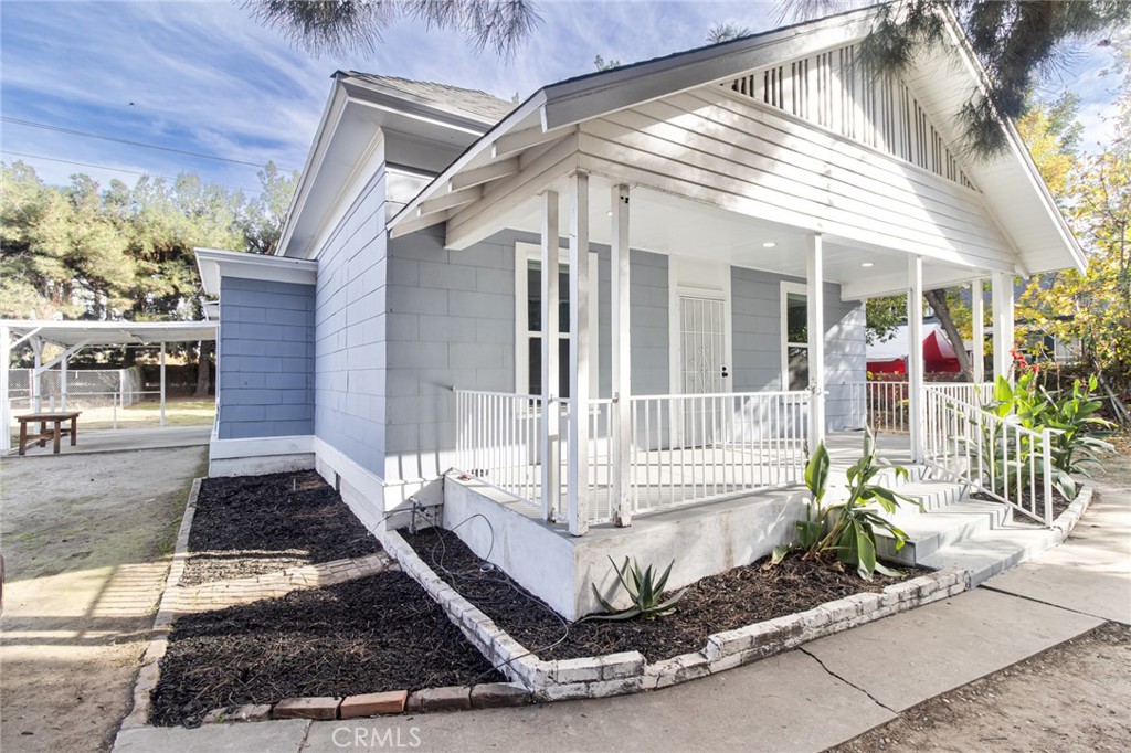 a front view of a house with a porch