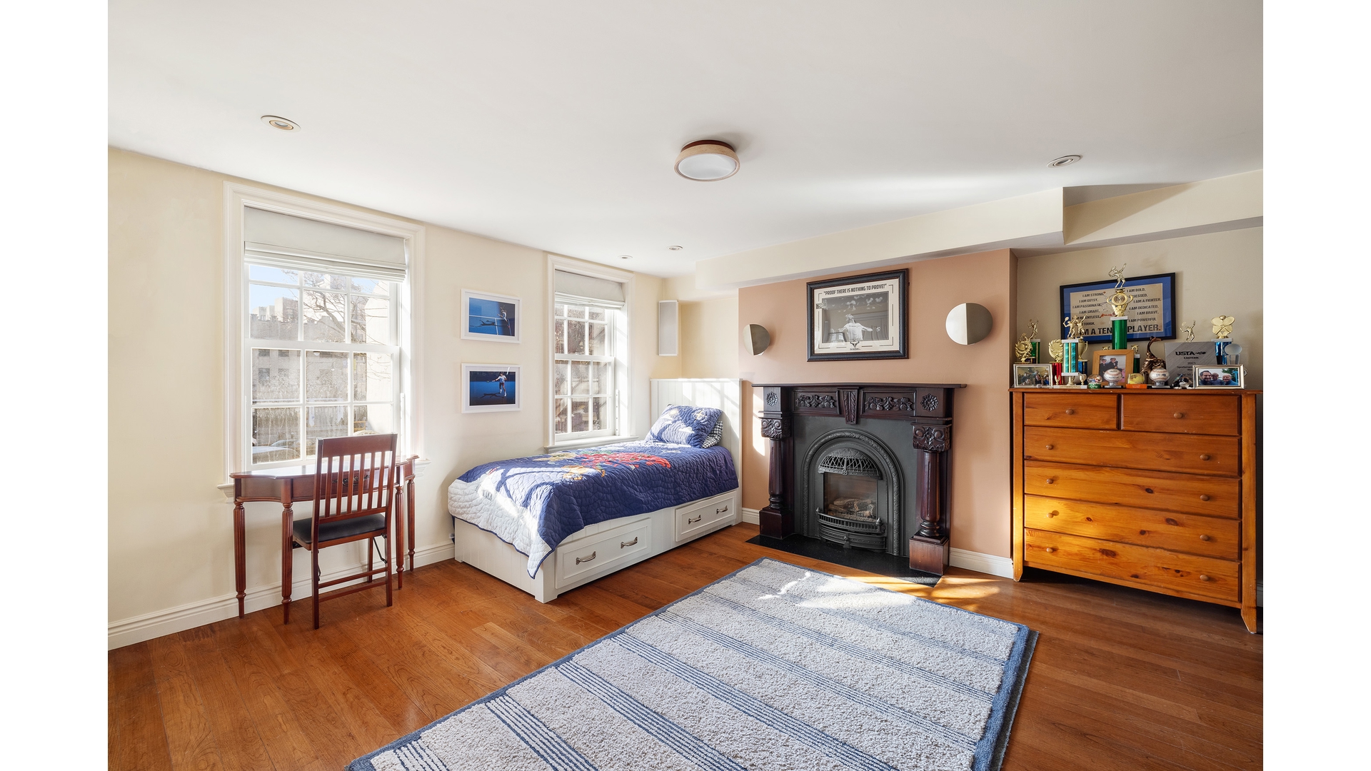 13 Commerce Street Manhattan, NY 10014 - Photo 11 of 13 a living room with furniture and a fireplace