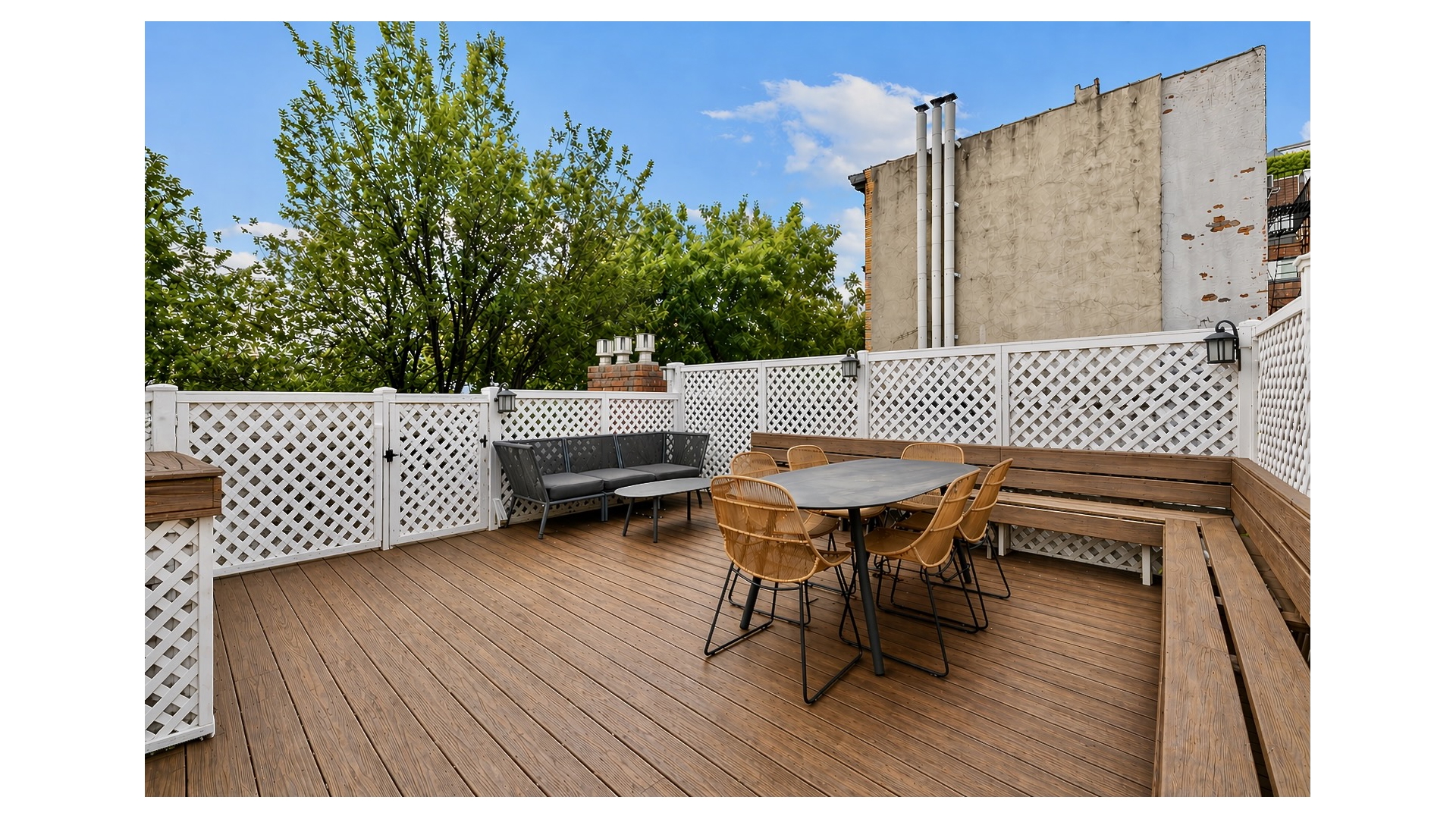 13 Commerce Street Manhattan, NY 10014 - Photo 8 of 13 a terrace of a house with wooden floor outdoor seating and yard in the back