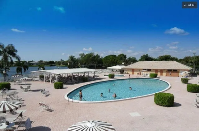 a room with lots of wooden furniture and large windows