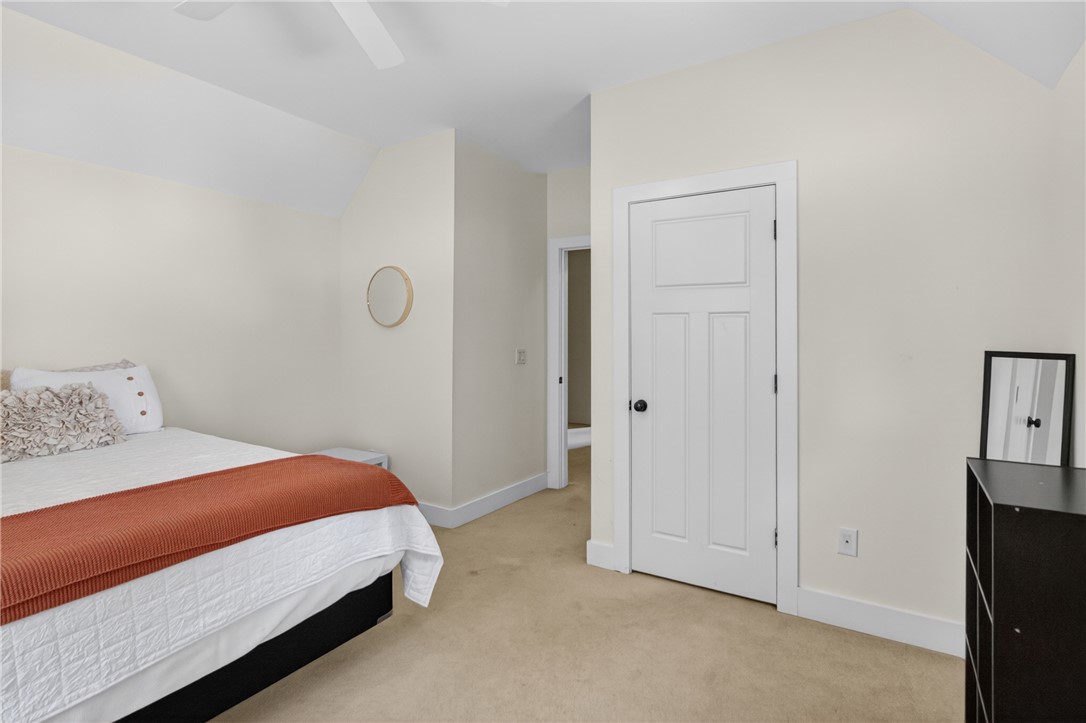 1504 Double Springs Road Townville, SC 29689 - Photo 32 of 41 This inviting bedroom offers comfort and a tranquil atmosphere with soft carpet flooring.