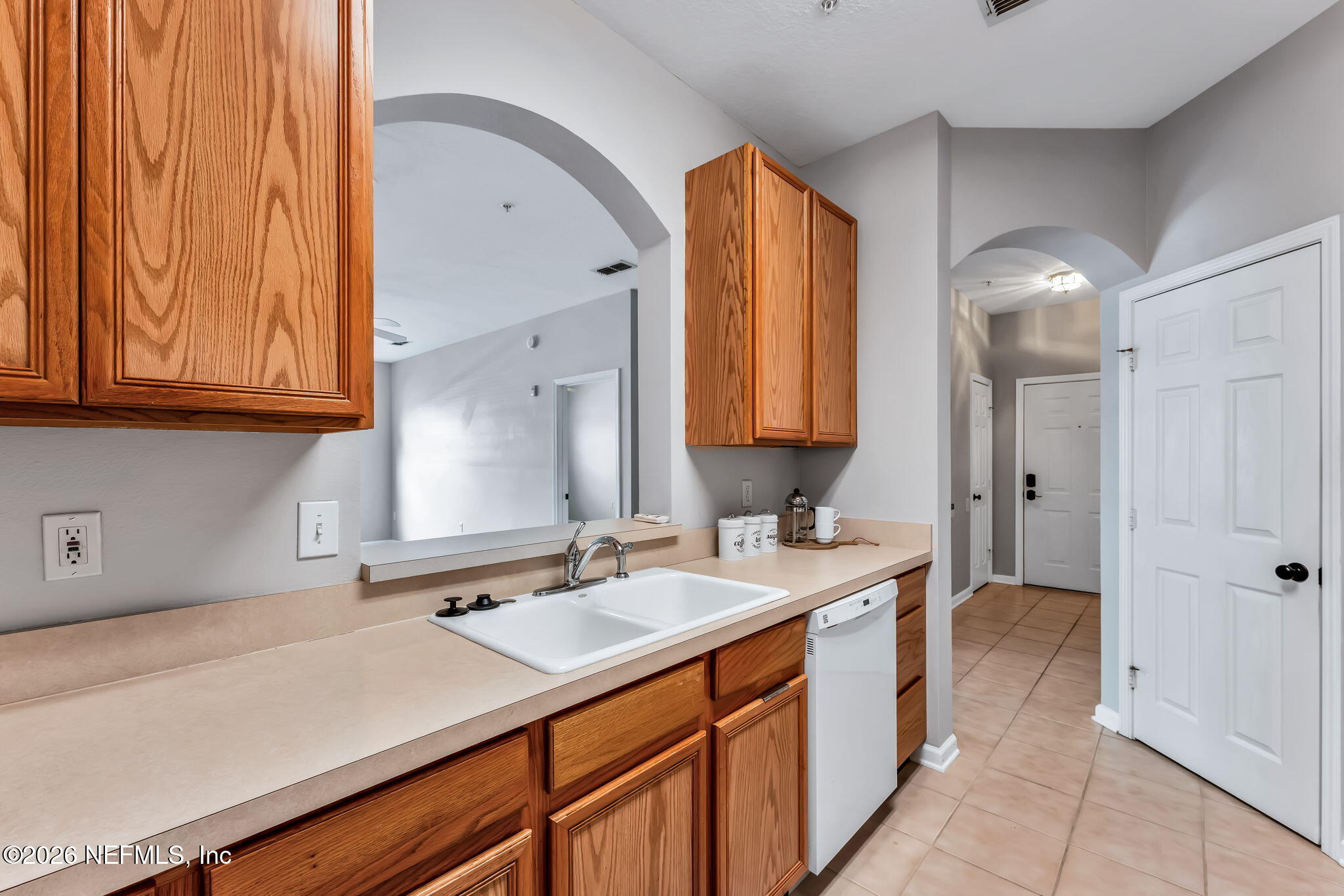 7990 Baymeadows Road East, Unit 520 Jacksonville, FL 32256 - Photo 9 of 41 a bathroom with a sink and a mirror