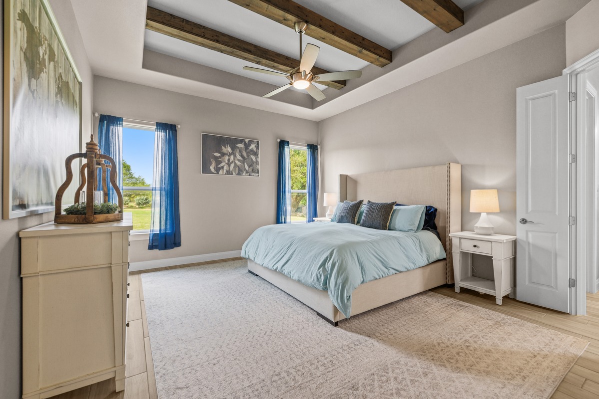 329 Independence Drive Georgetown, TX 78633 - Photo 11 of 34 a spacious bedroom with a bed and a dresser