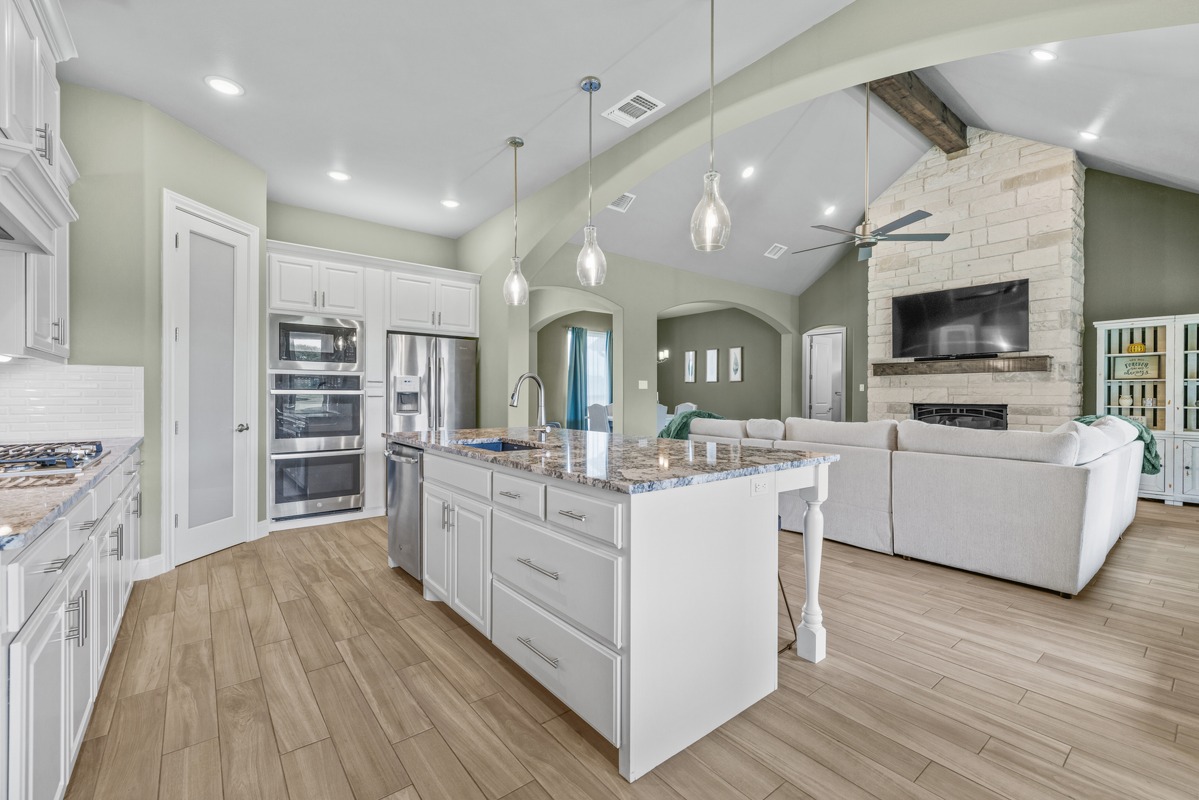 329 Independence Drive Georgetown, TX 78633 - Photo 28 of 34 a large white kitchen with kitchen view and living room view