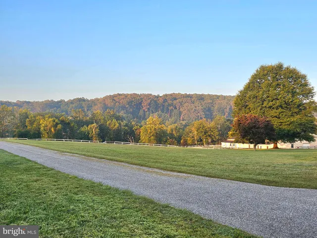 a view of a golf course with a lake view