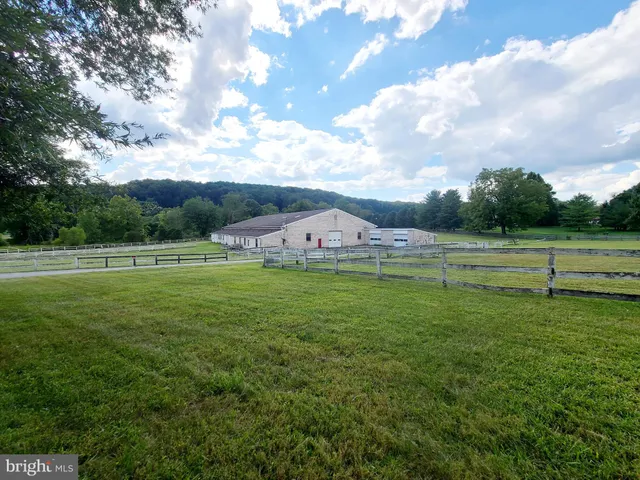 a view of a lake with houses in the back