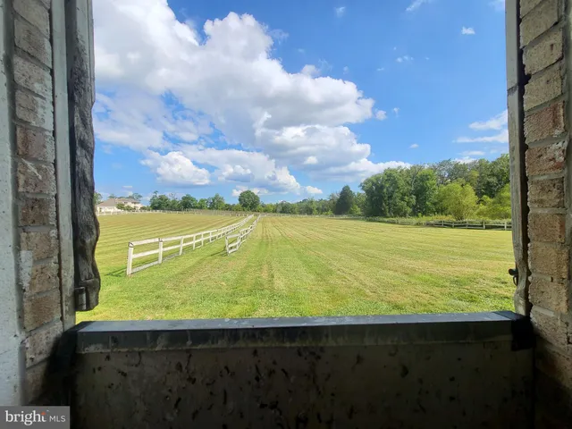 a view of a room with a large window
