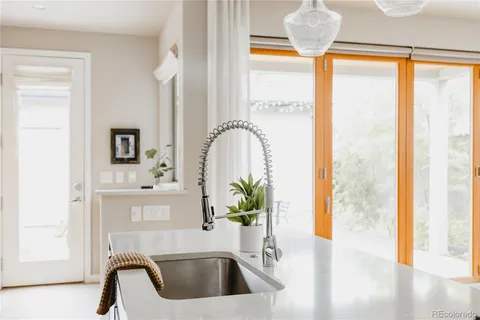 a bathroom with a sink a bathtub and a window