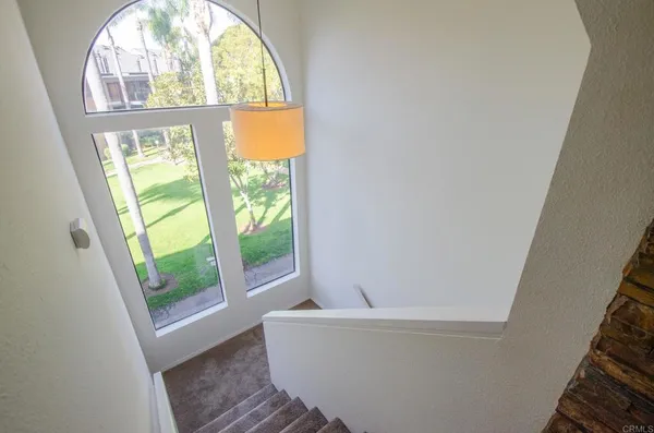 a white bath tub sitting next to a window