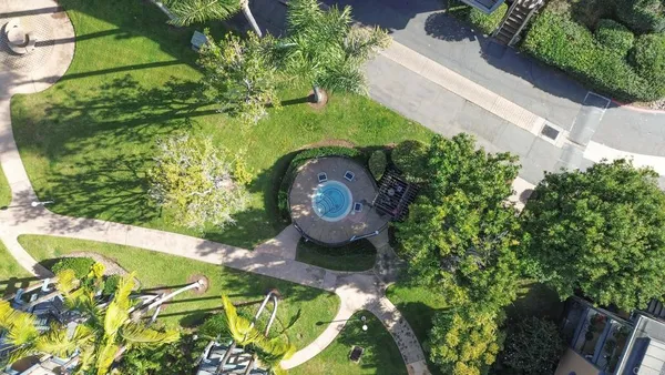 a view of a garden with a fountain