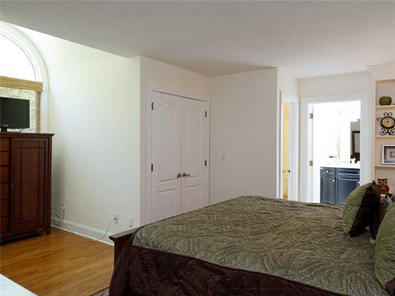 102 Long Close Road Stamford, CT 06902 - Photo 12 of 25 a bedroom with a bed and a flat screen tv